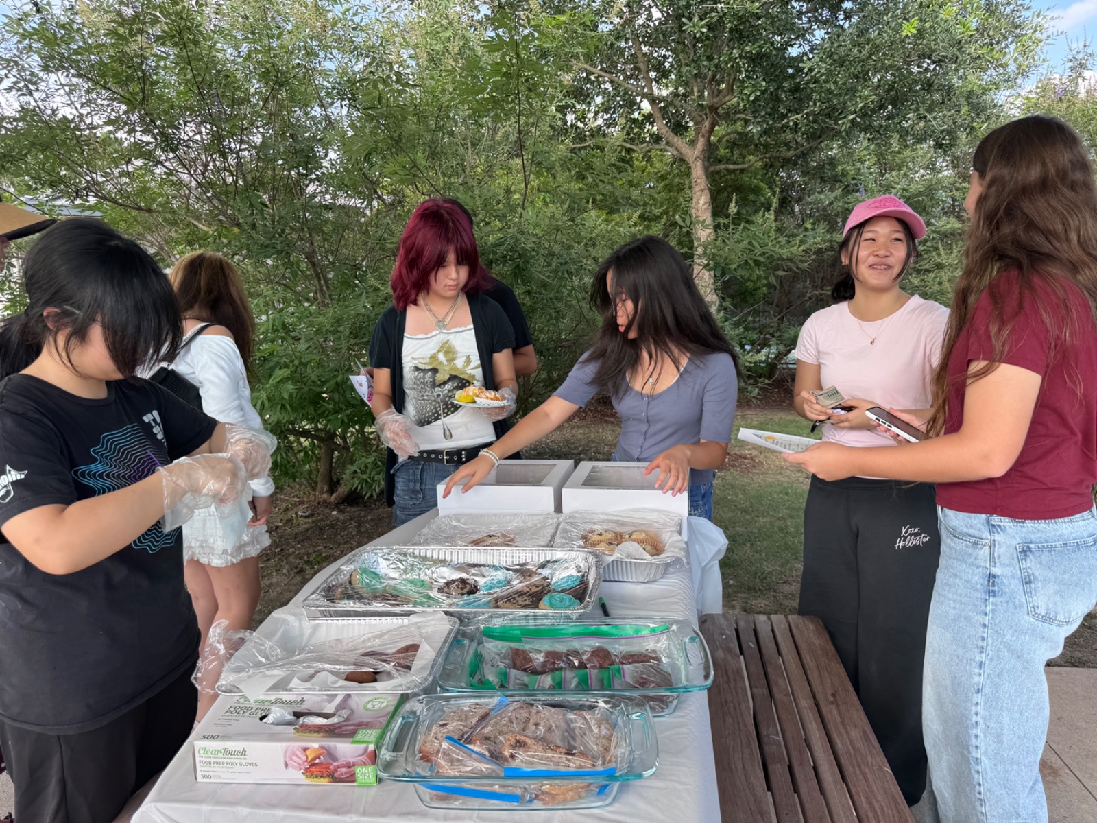 Paeonia student volunteers running a community bake sale