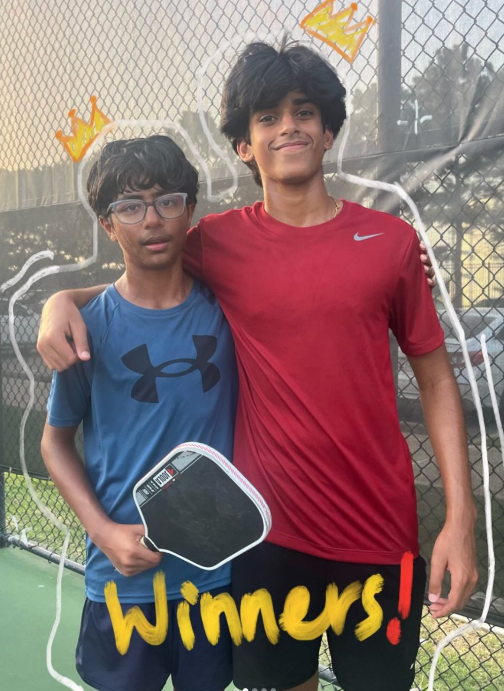 Two winners of the Houston branch pickleball tournament posing on the court