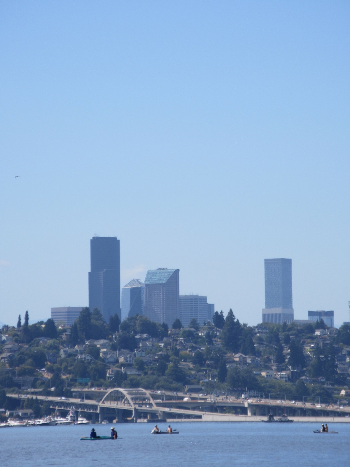 Seattle skyline across the water with kayakers